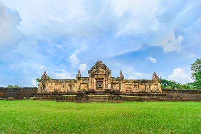 Historic building against cloudy sky