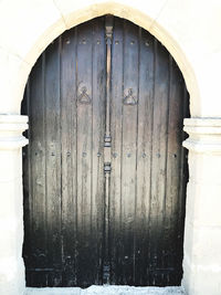 Closed wooden door of old building
