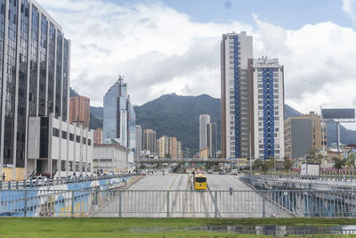 Modern buildings in city against sky