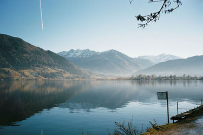 Scenic view of lake with mountain range in background