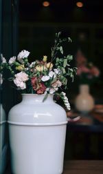 Close-up of white flower vase on table