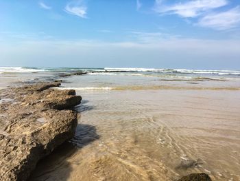 Scenic view of beach against sky