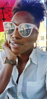 Portrait of smiling young man wearing sunglasses