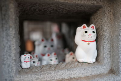 Close-up of cat figurines for sale in market