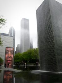 Modern buildings in city against sky