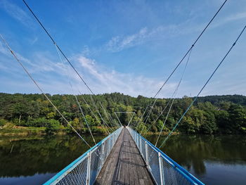 The old bridge with a blue railing over the dunajec river. dunajec poland.