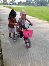 Full length of a woman riding bicycle