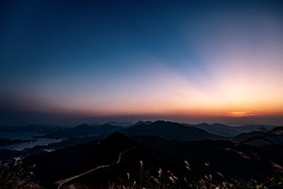 Scenic view of mountains against sky during sunset