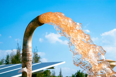 Low angle view of water against blue sky