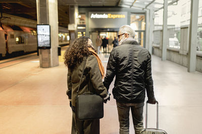 Couple on train station platform