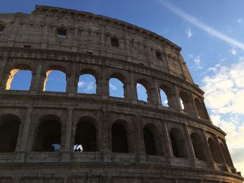 Low angle view of historical building against blue sky