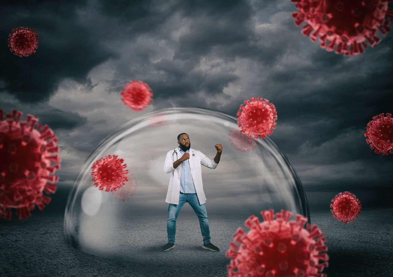 DIGITAL COMPOSITE IMAGE OF WOMAN STANDING BY RED FLOWERS