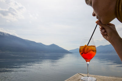 Close-up of woman drinking cocktail