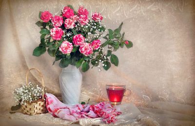 Close-up of roses in vase on table