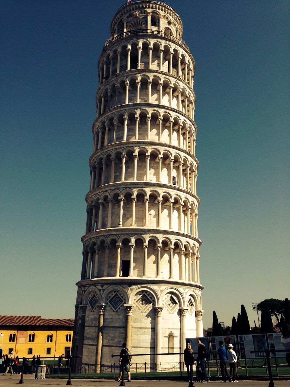 architecture, built structure, clear sky, building exterior, famous place, tourism, travel destinations, international landmark, low angle view, travel, large group of people, history, tourist, blue, tower, capital cities, men, leisure activity, person