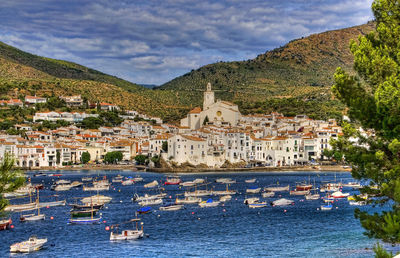 Buildings in town against a cloudy sky.  cadequés in southern spain near the french border