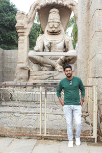 Mid adult man statue against historic building