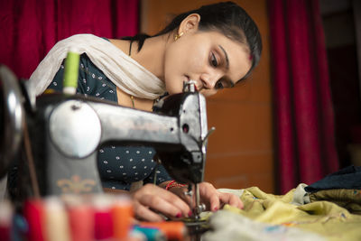 Man using sewing machine