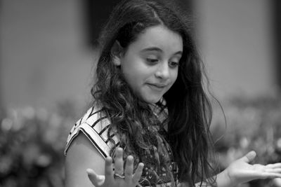 Portrait of a teenage girl looking down