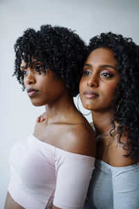 Portrait of two women of color hugging each other