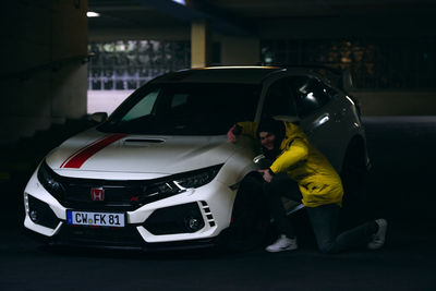 Side view of people standing in car