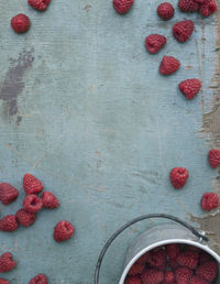 Raspberries on blue background