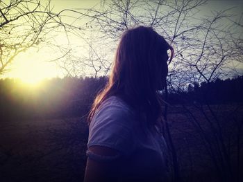 Silhouette of woman at sunset