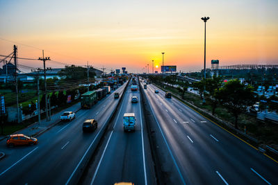 High angle view of vehicles on road against sky during sunset