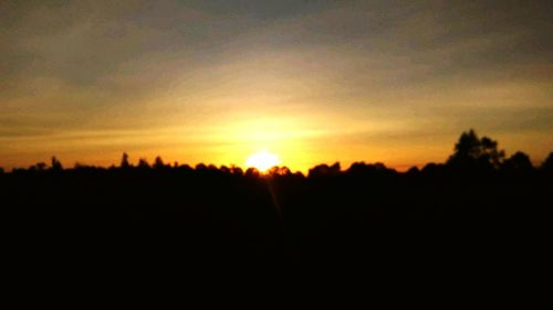 Scenic view of silhouette landscape against sky during sunset