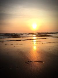 Scenic view of sea against sky at sunset