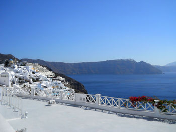 Scenic view of sea against clear blue sky