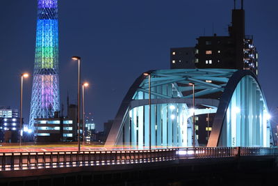 Illuminated modern building against sky at night