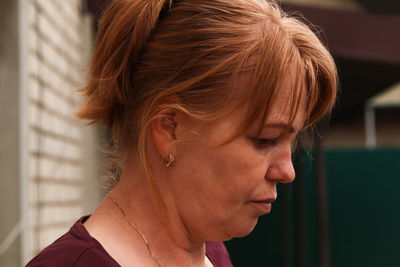 Close-up of young woman looking away