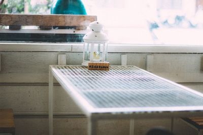 Close-up of glass bottle on table