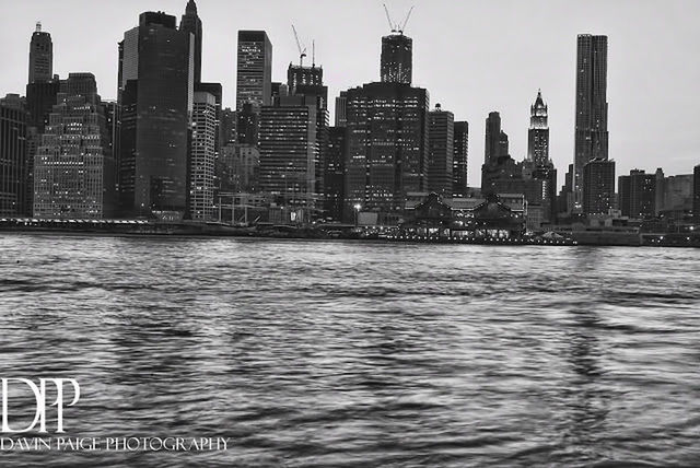 RIVER AND BUILDINGS AGAINST SKY IN CITY