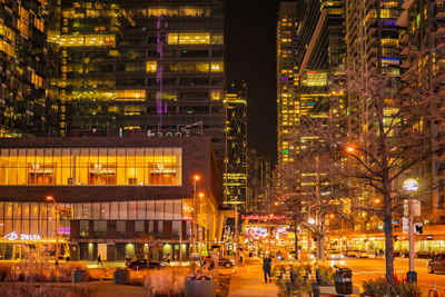 Illuminated buildings in city at night