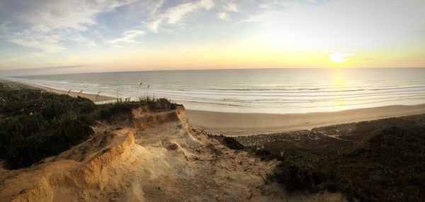 Scenic view of sea at sunset