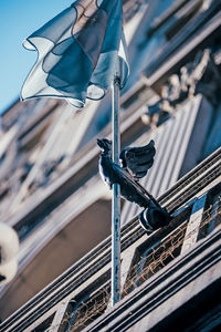 Low angle view of flag in city