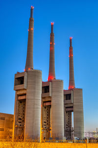 The disused thermal power station at sand adria near barcelona at dusk