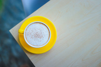 High angle view of coffee cup on table