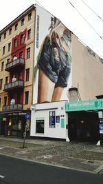 Woman in front of building