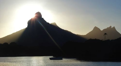 Scenic view of silhouette mountains against sky during sunset