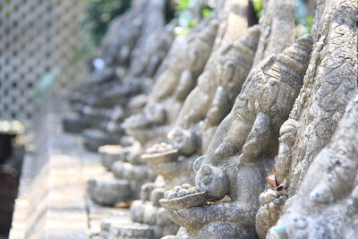 Statue of buddha against temple