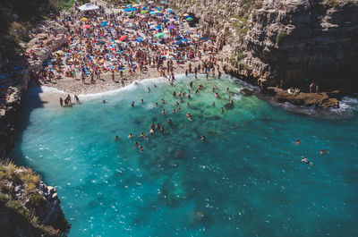 High angle view of people swimming in sea