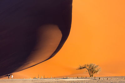 Scenic view of landscape against clear sky during sunset