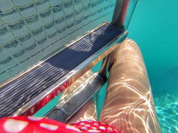 Low section of person in swimming pool
