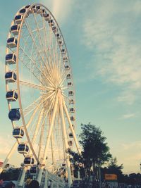 Low angle view of ferris wheel against sky