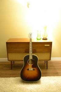 Close-up of guitar on table at home