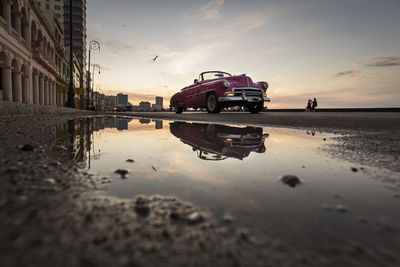 Reflection of buildings in puddle