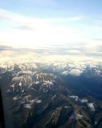 Aerial view of snow covered mountains